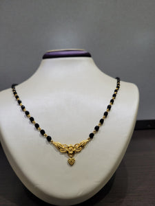 24" Black Bead Mangal Sutra with 10k Gold wire and floral design and dangling heart