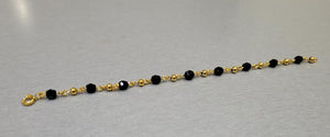 5.5" Black Bead Bracelet with 10k gold ball