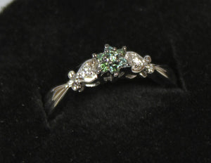 14k white gold star set green and white diamond 0.20ct ring with black rhodium.