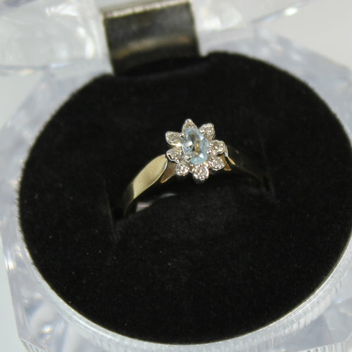 10k ladies colour stone ring with genuine 8x5 oval Aquamarine center stone and 0.06ct diamond.