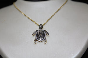FS1008: 10k 0.40 ct TW diamond turtle pendant with box chain