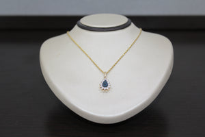 FS1009: 10k 0.27 ct TW blue diamond pendant with box chain