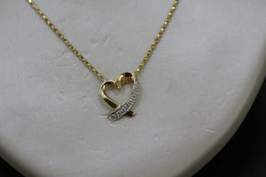 FS1018: 10k 0.02 ct TW diamond heart pendant with box chain