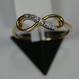 R0811: 10k infinity diamond ring with 0.10ct