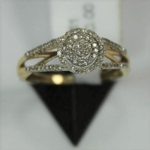 R0561: 10k cluster stone halo ring with 0.20ct diamonds.