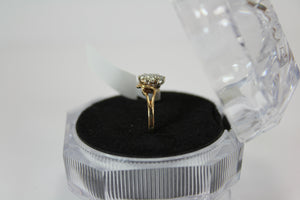 10k cluster ring made up of 0.16ct diamond