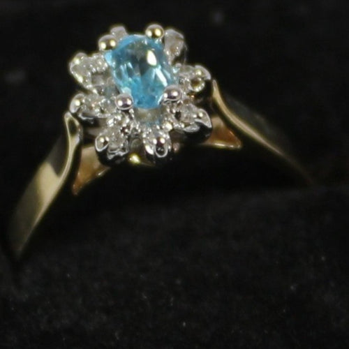 10k ladies colour stone ring with genuine 5x3 oval Aquamarine center stone and 0.06ct diamond.