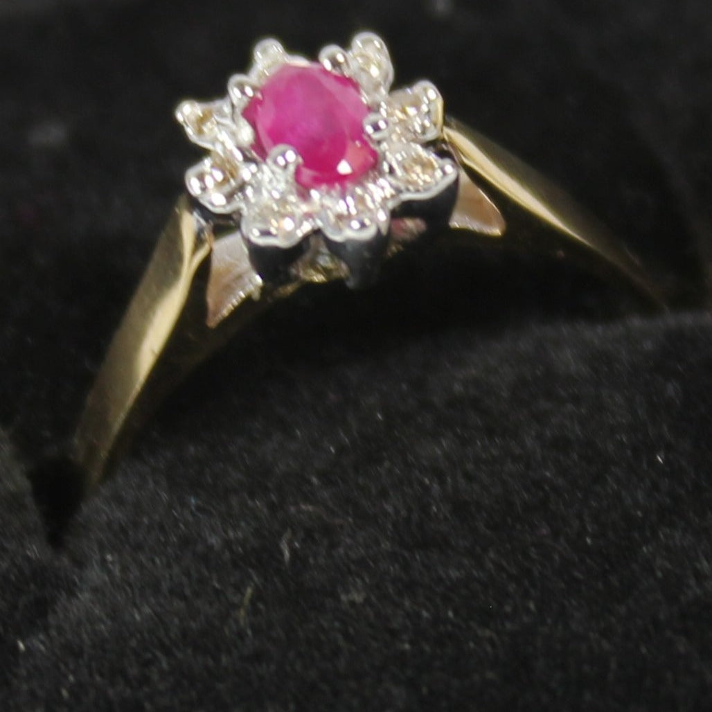 10k ladies colour stone ring with genuine 5x3 oval Ruby center stone and 0.06ct diamond.