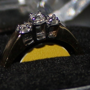 14k 2 tone 3 stone ring with 0.15ct diamond.